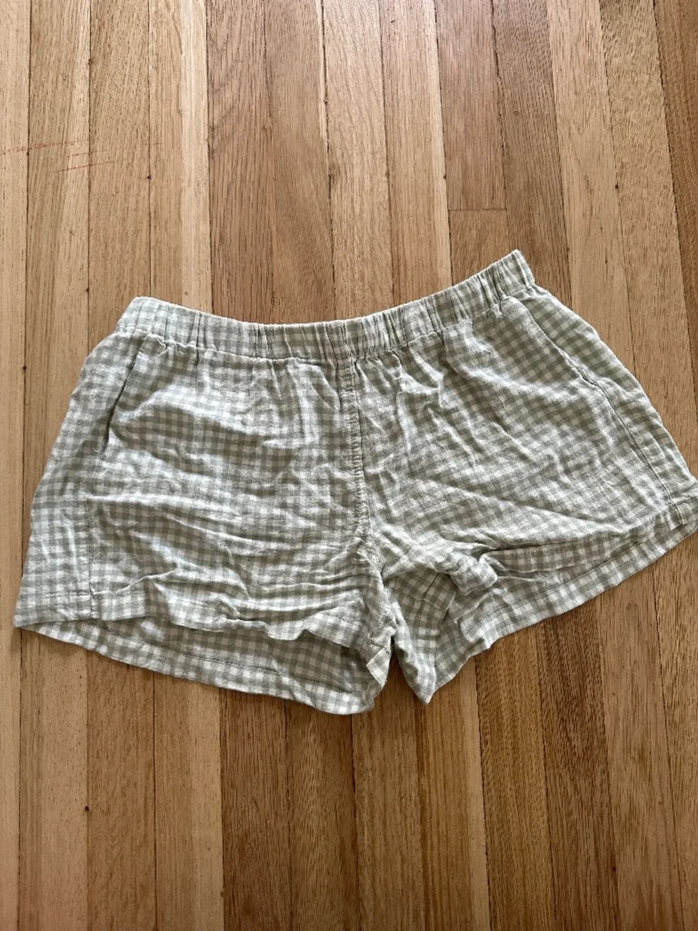Brandy Melville, green and white mini shorts